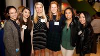 Students pose together at Alumni event.
